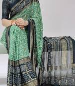 green color bandhni printed with foil work moss art silk saree with unstitched blouse