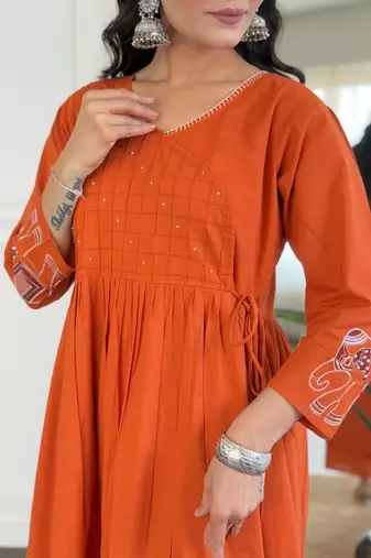 Floral embroidered orange v neck cotton kurta set with trouser