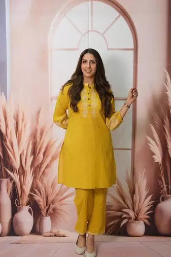 Floral embroidered yellow round neck cotton kurta set with trouser