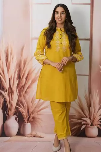 Floral embroidered yellow round neck cotton kurta set with trouser