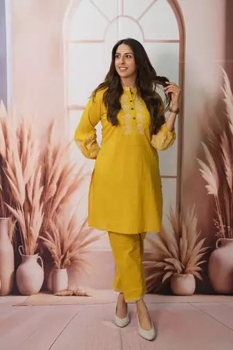 Floral embroidered yellow round neck cotton kurta set with trouser