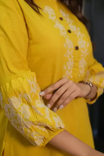 Floral embroidered yellow round neck cotton kurta set with trouser