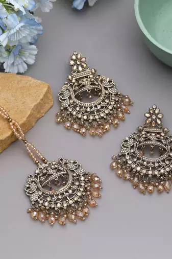 Gold color kundan earrings tikka set