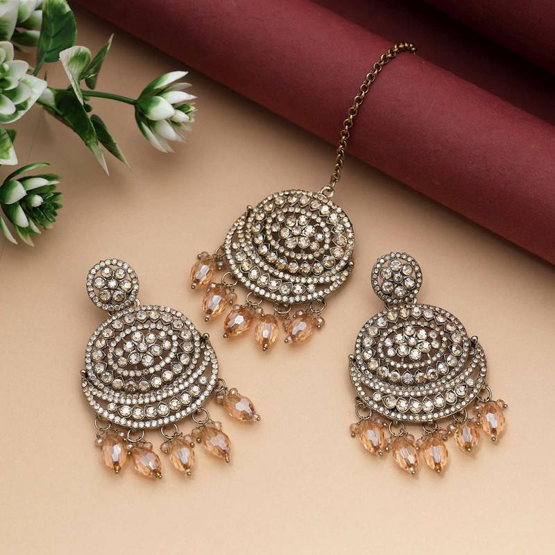 Gold color kundan earrings tikka set