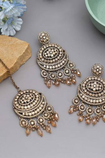 Gold color kundan earrings tikka set