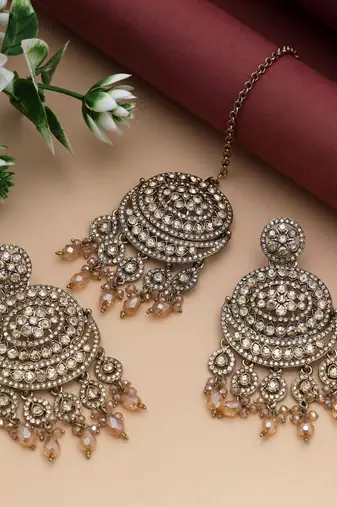 Gold color kundan earrings tikka set