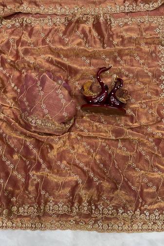 brown color embroidered space silk blend saree