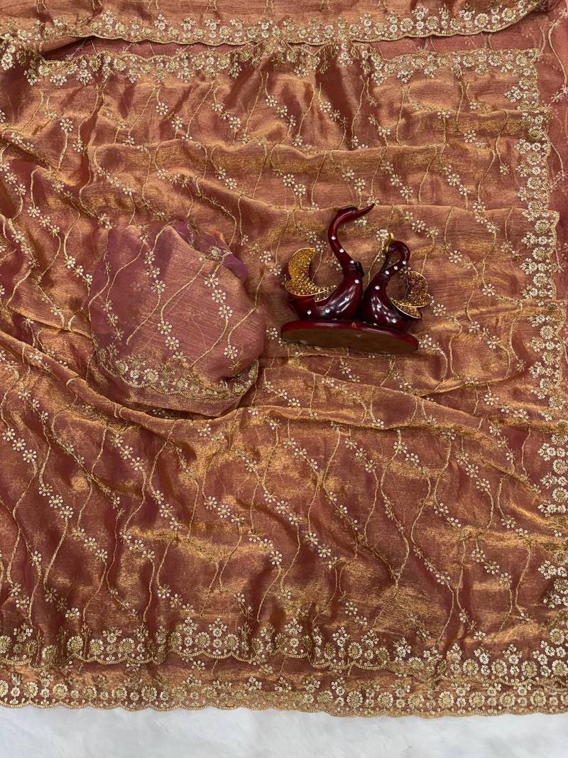 brown color embroidered space silk blend saree