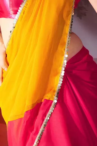 mustard and pink colourblocked designer georgette saree with blouse