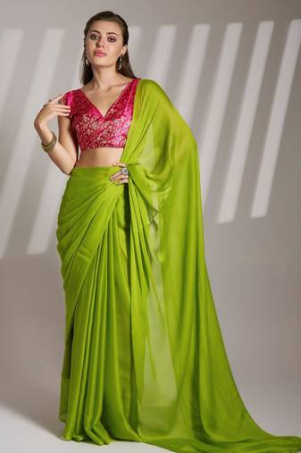 green chiffon saree with tassels and blouse
