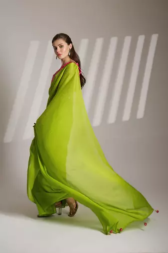 green chiffon saree with tassels and blouse
