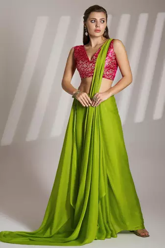 green chiffon saree with tassels and blouse