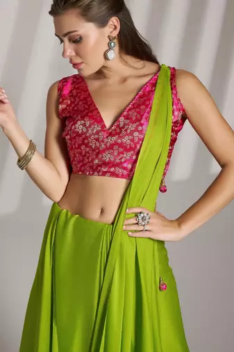 green chiffon saree with tassels and blouse