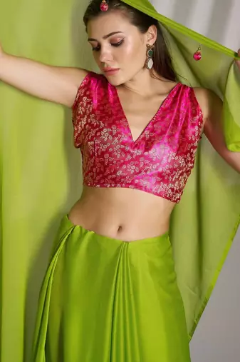 green chiffon saree with tassels and blouse