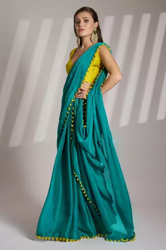 sea green solid chiffon saree with contrast blouse piece