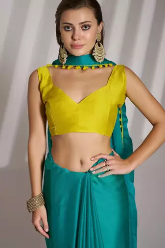 sea green solid chiffon saree with contrast blouse piece