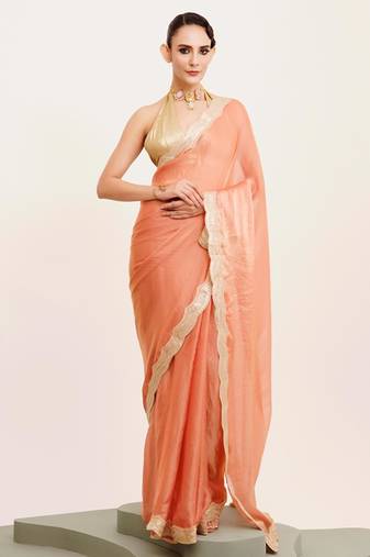 Peach solid satin saree with embellished border