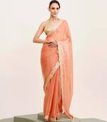 Peach solid satin saree with embellished border