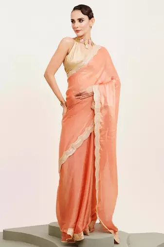 Peach solid satin saree with embellished border
