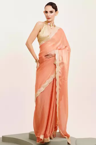 Peach solid satin saree with embellished border