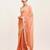 Peach solid satin saree with embellished border