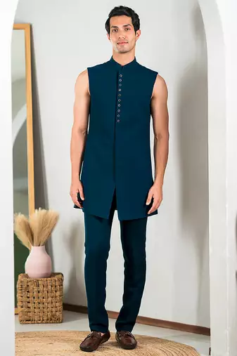 Peacock green indowestern with tranquil nature detailing thread and stone work