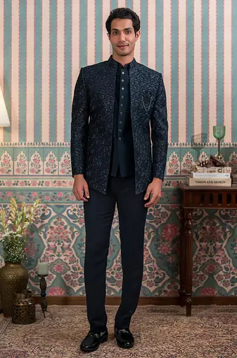 Deep green jodhpuri suit with sequins and thread work