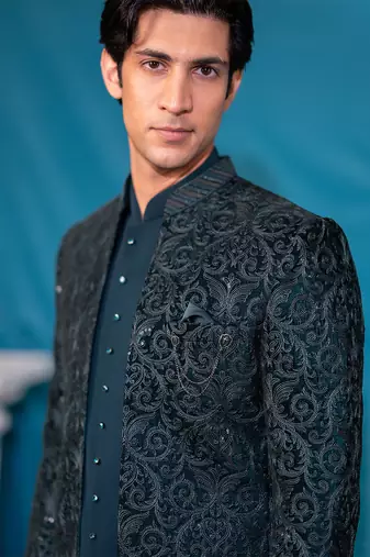 Green velvet jodhpuri suit with sequins and thread work