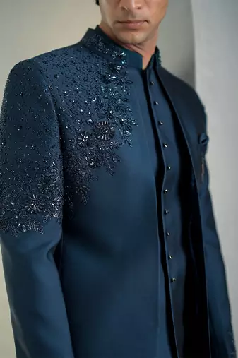 Blue jodhpuri suit with intricate floral hand embroidery