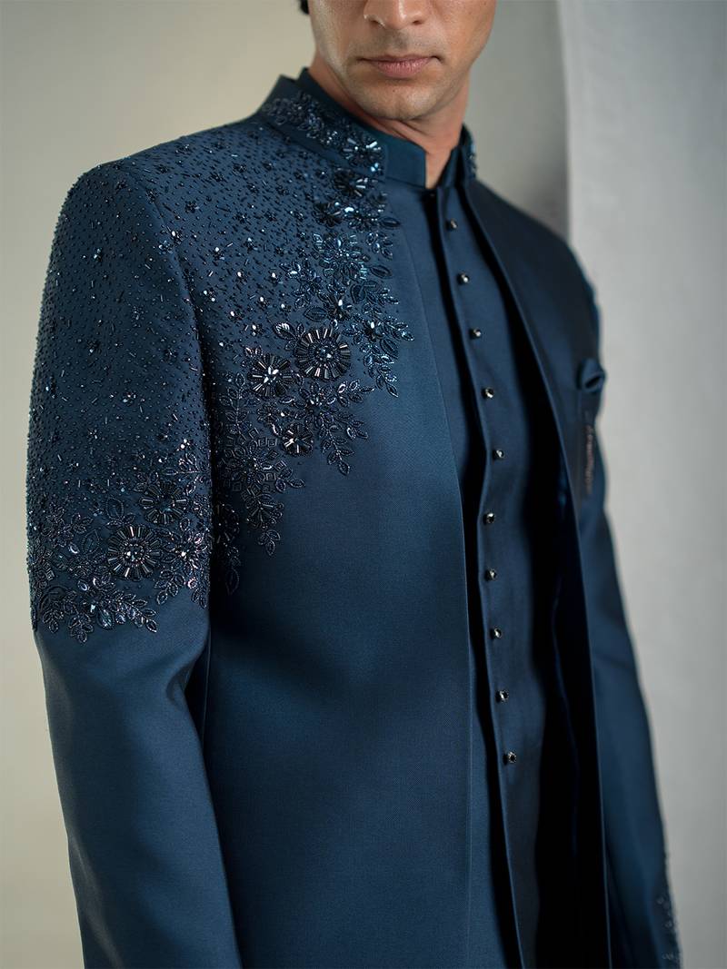 Blue jodhpuri suit with intricate floral hand embroidery