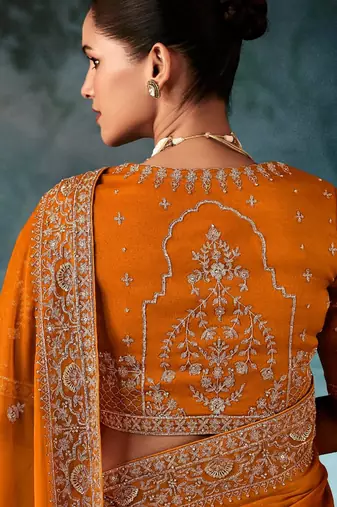 Orange  fancy hand work border with heavy designer blouse  wedding wear saree