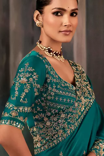 Teal fancy hand work border with heavy designer blouse  wedding wear saree