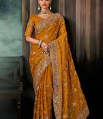 Mustard  fancy hand work border with heavy designer blouse  wedding wear saree
