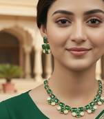 Golden plated precious stone necklace set with green quartz & pearl drops