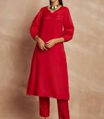 Red color v-neck three-quarter sleeves puffed sleeves a-line kurta with trousers