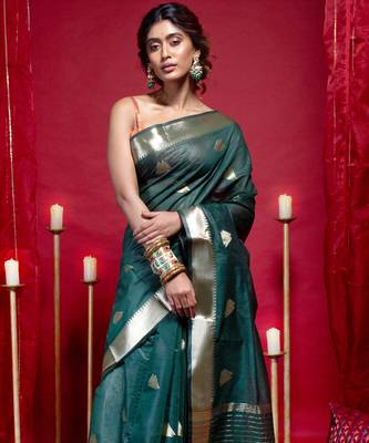 Banarasi kora organza saree in green color with triangle zari motifs and border 1