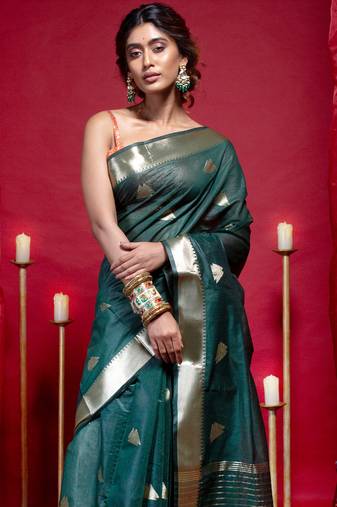 Banarasi kora organza saree in green color with triangle zari motifs and border