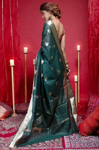 Banarasi kora organza saree in green color with triangle zari motifs and border
