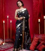Banarasi kora organza saree in black color with triangle zari motifs and border