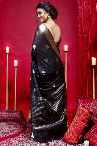 Banarasi kora organza saree in black color with triangle zari motifs and border