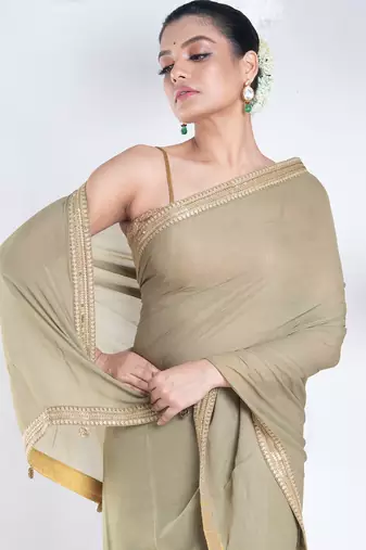 Georgette saree with olive green color with golden embroidered border