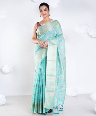 Banrasi kora organza saree in green color with multicolor abstract motifs and zari border 1