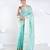Banrasi kora organza saree in green color with multicolor abstract motifs and zari border
