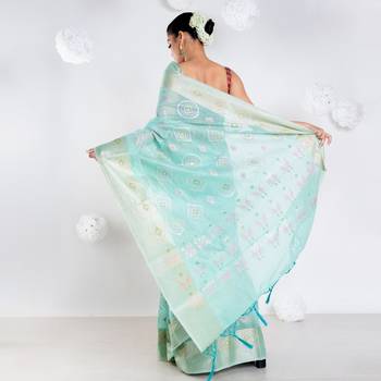 Banrasi kora organza saree in green color with multicolor abstract motifs and zari border 3