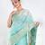 Banrasi kora organza saree in green color with multicolor abstract motifs and zari border