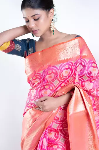 Banarasi kora cotton in sunset pink saree with patola elephant motis and contrasting border