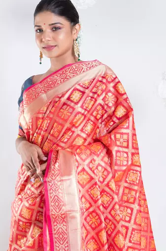 Varanasi chanderi saree in red color with tree motifs and golden border