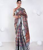 Banarasi kora organza saree in grey color with multicolor motifs with copper zari