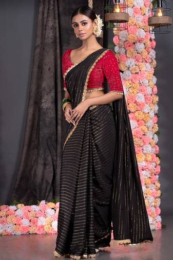 Black georgette saree with lurex gold stripes and scallop embroidered border