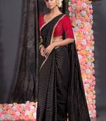 Black georgette saree with lurex gold stripes and scallop embroidered border